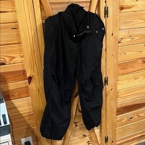 Black Track Pants with Relaxed Fit and Weather-Resistant Material